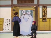 Kuno and Sasuke arrive at the Dojo, with Sasuke unintentionally placing Kuno's gift on Ryoga.