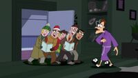 Doofenshmirtz is annoyed by the carolers.