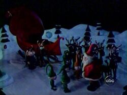 Rusty with the Kid, Santa, elves and the Sleigh Team