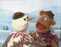 Fozzie with the snowman in A Muppet Family Christmas.