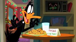 Daffy about to eat Santa's cookies