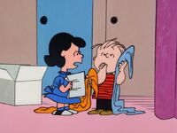 Lucy giving Linus his script