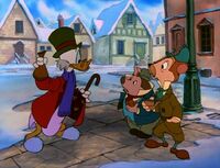 Scrooge giving money to Ratty and Mole