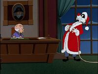 As Sylvester fools Totter by pretending to be Santa Claus...