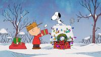 Snoopy and Charlie Brown in "Happiness is the Gift of Giving".