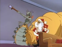 The Queen and Santa arrive at the first house...