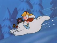 Frosty and Karen slide down a snowy hill...