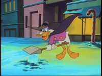 Darkwing directs the water from the broken hydrant.