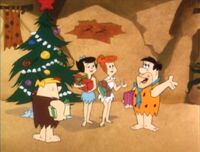 Afterwards, the Flintstones and Rubbles exchange Christmas gifts.