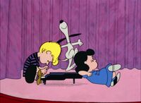 Schroeder notices Snoopy dancing on his piano.