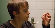 Andrew examining the wisdom teeth that he telekinetically pulled out of Wayne's mouth