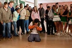 Wayne on the ground after his teeth are ripped out