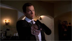 Casey aims his P229 with suppressor mounted