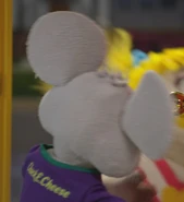 Backside of Chuck E.'s shirt, containing the "Chuck E. Cheese" text