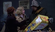 The Peddler selling Karen a Good Guy doll in Child's Play.