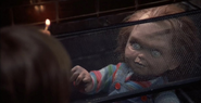 Chucky trying to stop Andy in Child's Play.