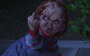 Chucky giving a man the middle finger in Bride of Chucky.