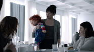 Claire taking Chucky away from Madeleine in Cult of Chucky.