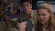 Jade and Jesse held at gunpoint by David in Bride of Chucky.