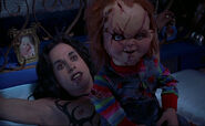 Chucky on top of Damien in Bride of Chucky.