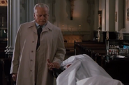 Harry Carey Jr. (under sheet) in The Exorcist III