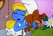 Squeaky (voiced by Frank Welker) dead with Smurfette (voiced by Lucille Bliss) in The Smurfs: Squeaky