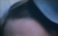 Kevin Costner (bit of head) in The Big Chill