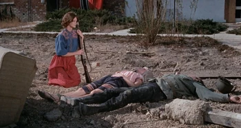 Barbara Lane (far left, kneeling) just before her death in The Cut-Throats