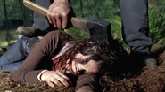 Aleksa Palladino dead with a hatchet being pulled out of her head in Wrong Turn 2: Dead End