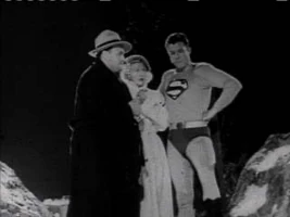 Norman Budd (far left), shortly before his death in Adventures of Superman: The Stolen Costume 