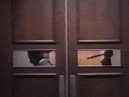 Richard Roundtree (left) about to be stabbed in Maniac Cop