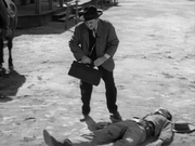 Martin Landau dead (on ground) with Milburn Stone in Gunsmoke: the Patsy
