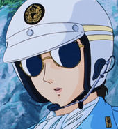 Close up of Kiyomi's face with her motorcycle helmet and sunglasses on