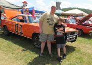 Me and my buddy from Facebook in front of his parents' General Lee