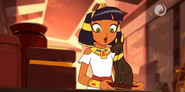 Cleo looks at an artifact inside the tomb