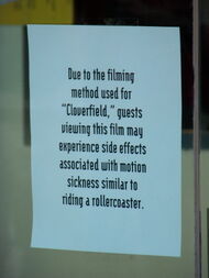 Sign at an AMC theater warning customers by comparing the film to a roller coaster.