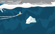 A penguin avoids an iceberg in Survival mode