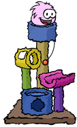 A Pink Puffle playing on the Scratch Tower.