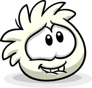 A white puffle biting on its mouth in the Adopt A Puffle catalog.