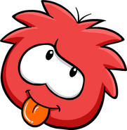 A red puffle cheerfully sticking its tongue out.