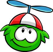A Green Puffle wearing the Propeller Cap