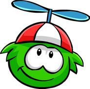 A Green Puffle wearing the Propeller Cap.