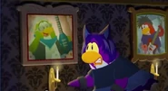 One of the three penguins looking at the portrait of Petey K
