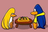 Bernie playing Mancala with a yellow penguin, as seen in the old version of the Mancala postcard