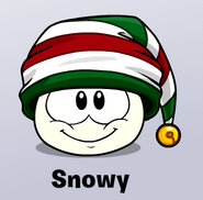 A White Puffle wearing a Candy Cane Cap