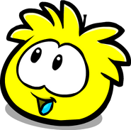 A Yellow Puffle looking to its left
