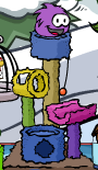 Purple Puffle playing with a scratch tower