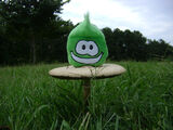 A green puffle on a mushroom.