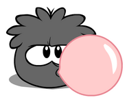 A Black Puffle blowing Puffle Bubble.