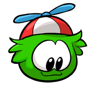 A Green Puffle looking down.